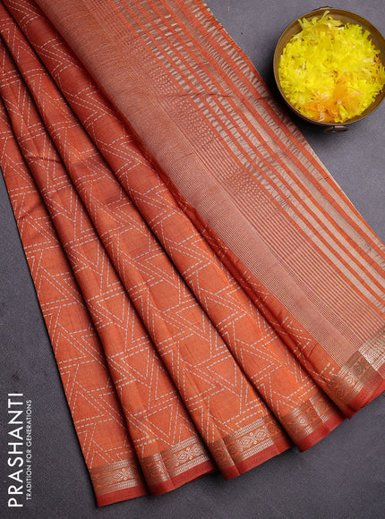 Semi raw silk saree rust shade with allover geometric prints and zari woven border