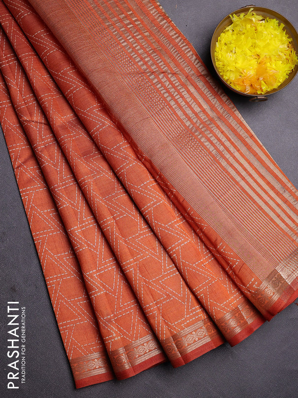 Semi raw silk saree rust shade with allover geometric prints and zari woven border