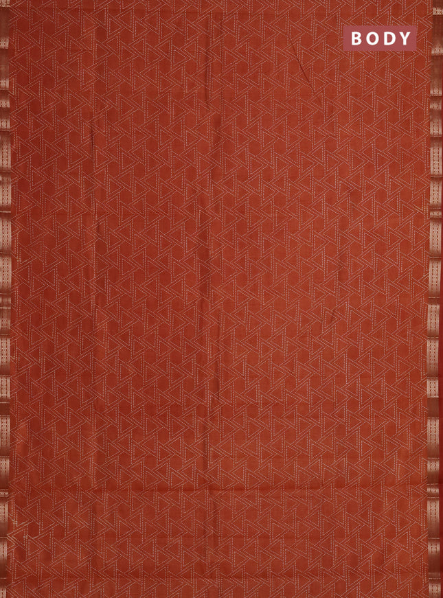 Semi raw silk saree rust shade with allover geometric prints and zari woven border