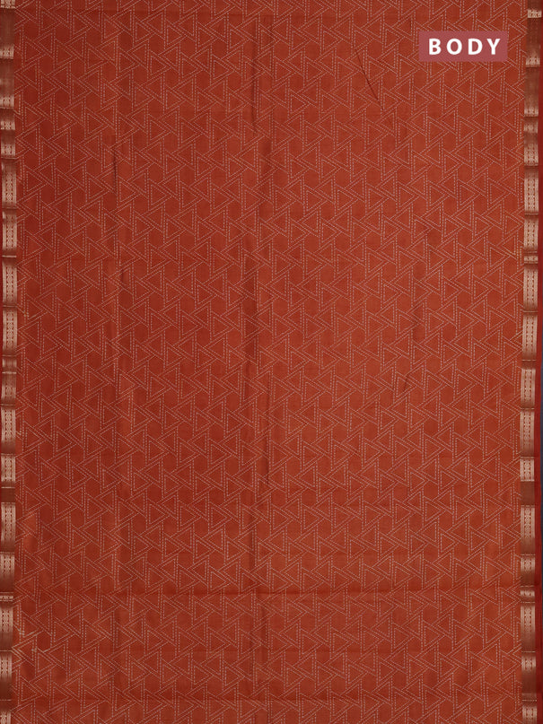 Semi raw silk saree rust shade with allover geometric prints and zari woven border