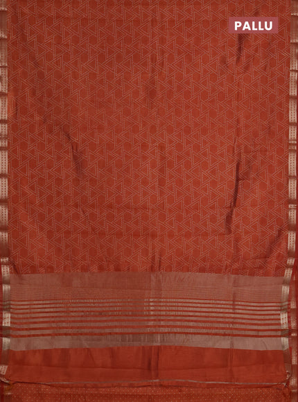 Semi raw silk saree rust shade with allover geometric prints and zari woven border