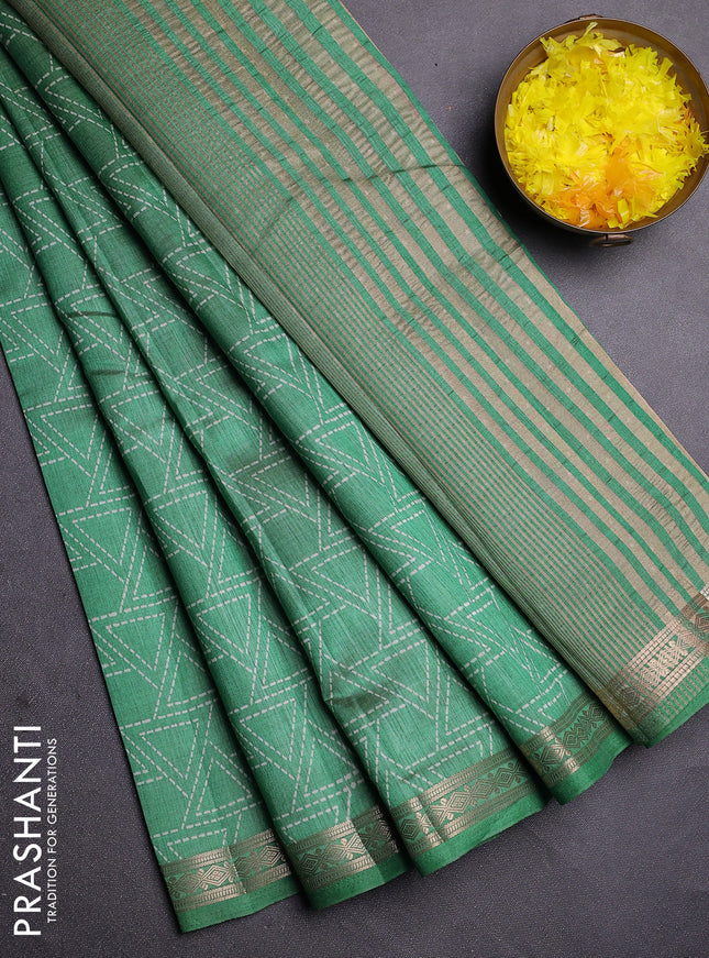 Semi raw silk saree green shade with allover geometric prints and zari woven border