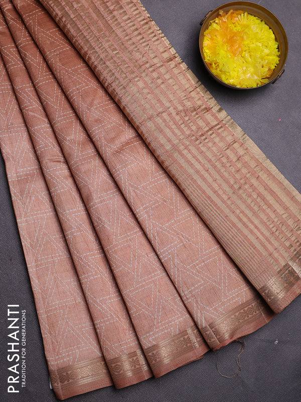 Semi raw silk saree pastel peach with allover geometric prints and zari woven border