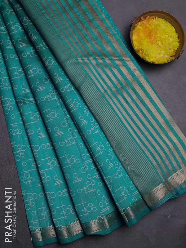 Semi raw silk saree teal blue with allover geometric prints and zari woven border