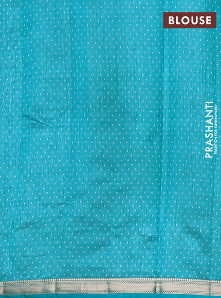 Semi raw silk saree teal blue with allover geometric prints and zari woven border