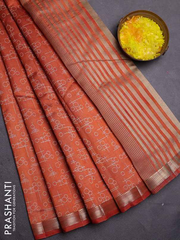 Semi raw silk saree rust shade with allover geometric prints and zari woven border