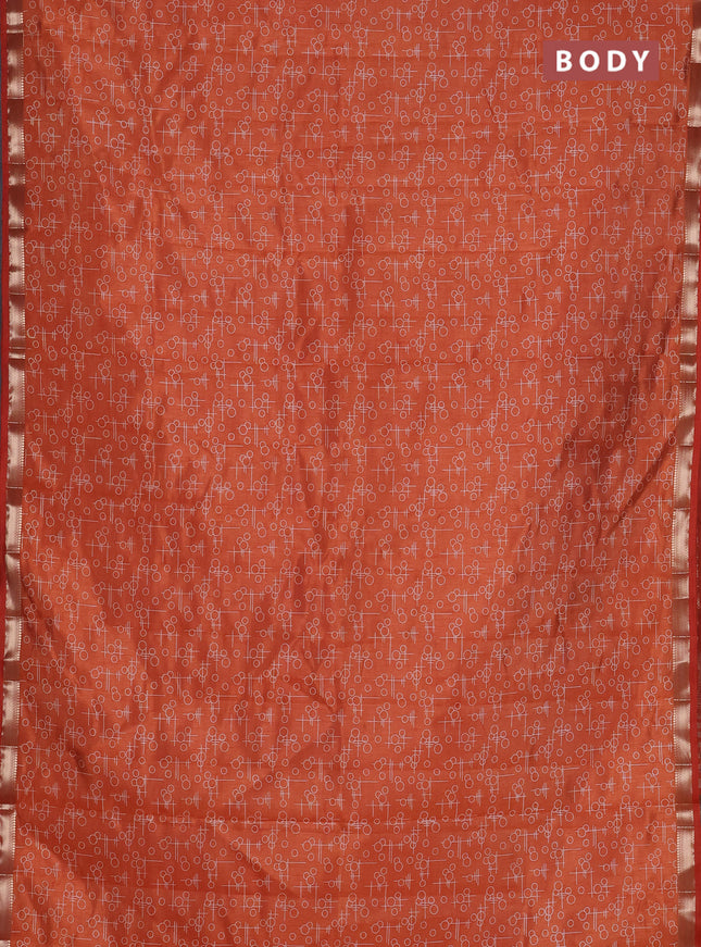 Semi raw silk saree rust shade with allover geometric prints and zari woven border