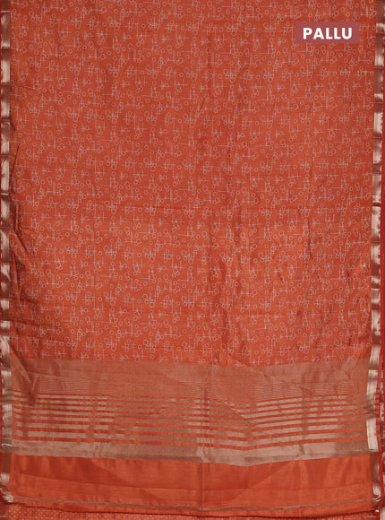 Semi raw silk saree rust shade with allover geometric prints and zari woven border