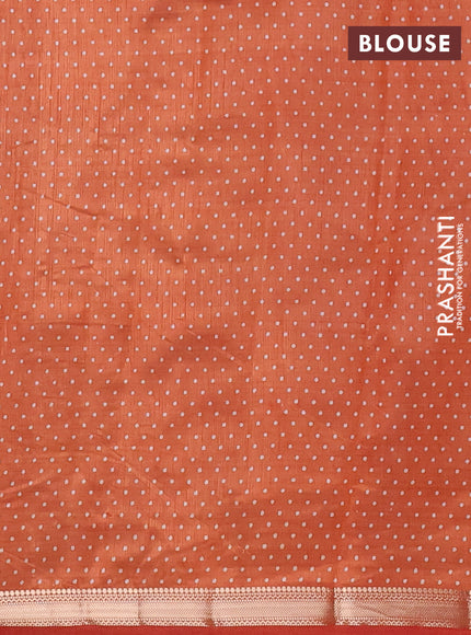 Semi raw silk saree rust shade with allover geometric prints and zari woven border