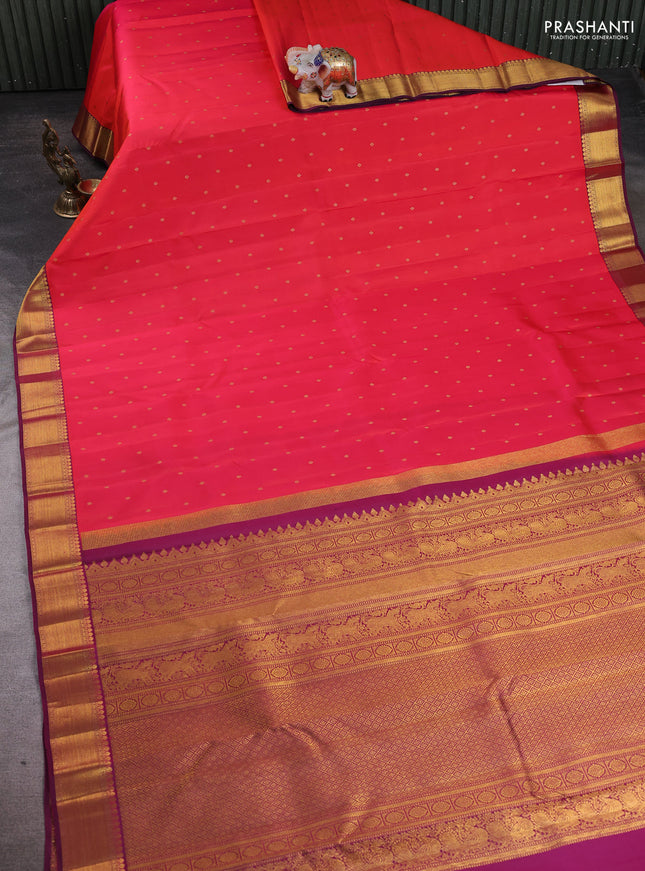 Pure kanchipuram silk saree pinkish orange and dark magenta pink with allover zari woven buttas and zari woven border