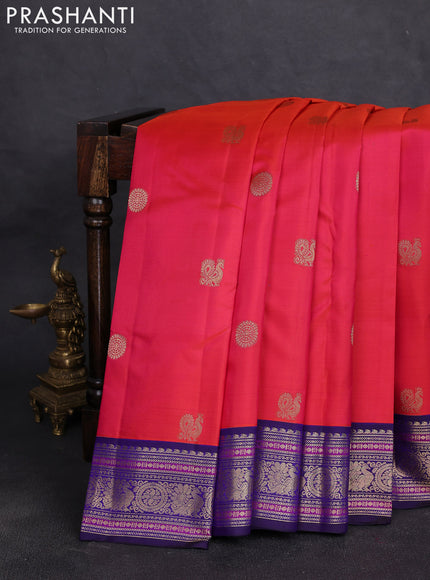 Pure kanchipuram silk saree pinkish orange and navy blue with allover zari woven buttas and zari woven border