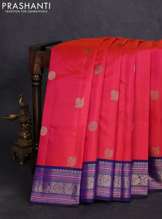 Pure kanchipuram silk saree pinkish orange and navy blue with allover zari woven buttas and zari woven border