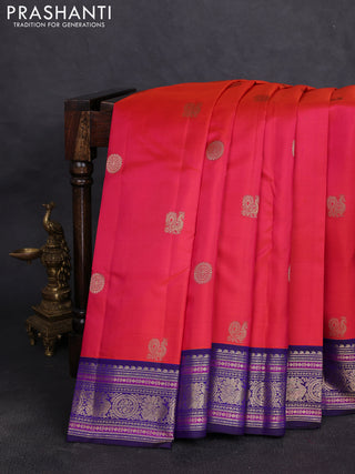 Pure kanchipuram silk saree pinkish orange and navy blue with allover zari woven buttas and zari woven border