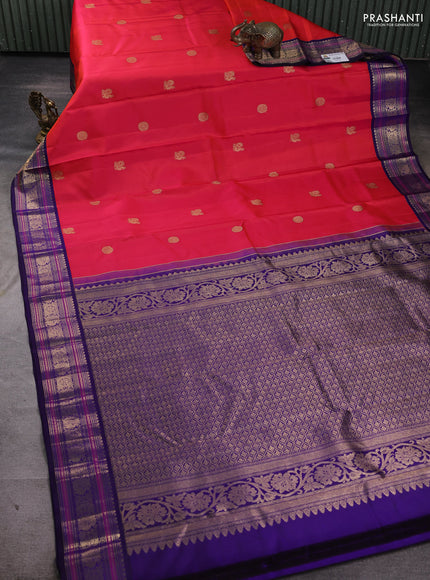Pure kanchipuram silk saree pinkish orange and navy blue with allover zari woven buttas and zari woven border