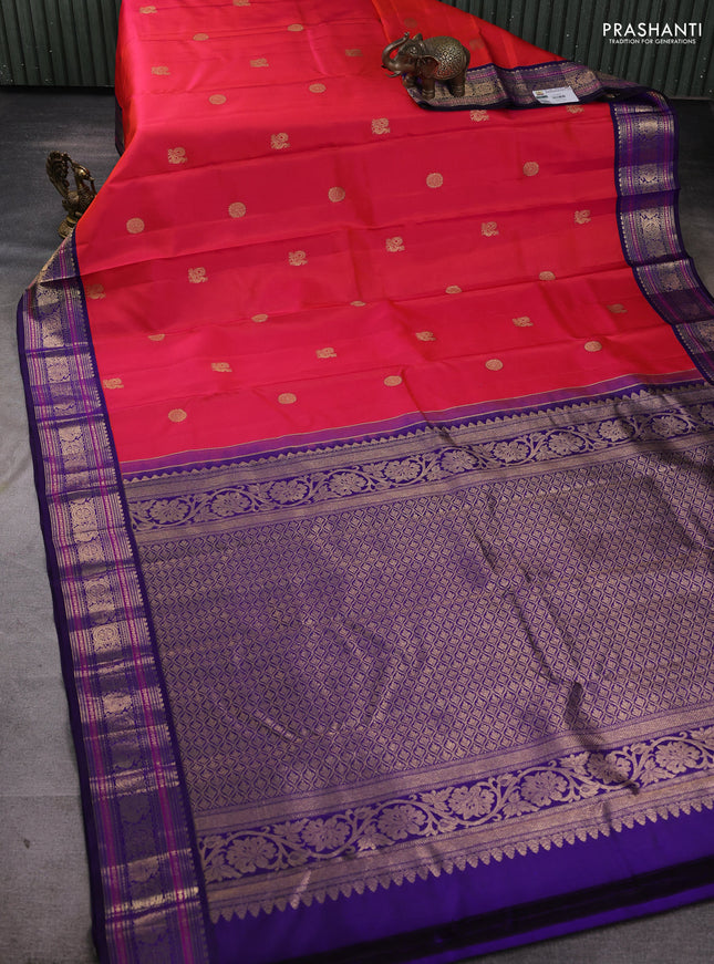 Pure kanchipuram silk saree pinkish orange and navy blue with allover zari woven buttas and zari woven border