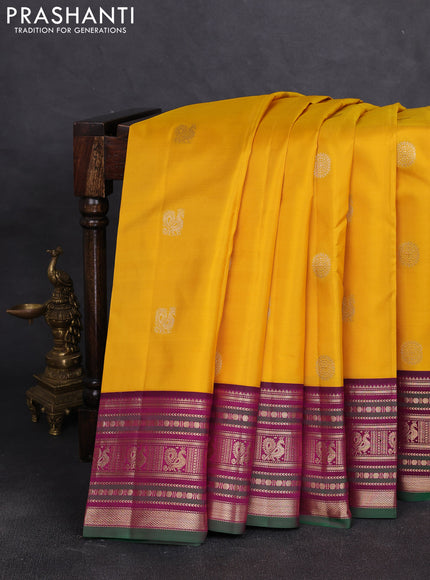 Pure kanchipuram silk saree yellow and dark magenta with allover zari woven buttas and zari woven border