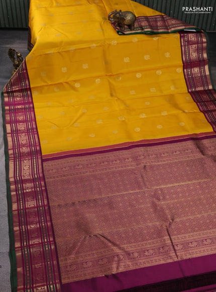 Pure kanchipuram silk saree yellow and dark magenta with allover zari woven buttas and zari woven border