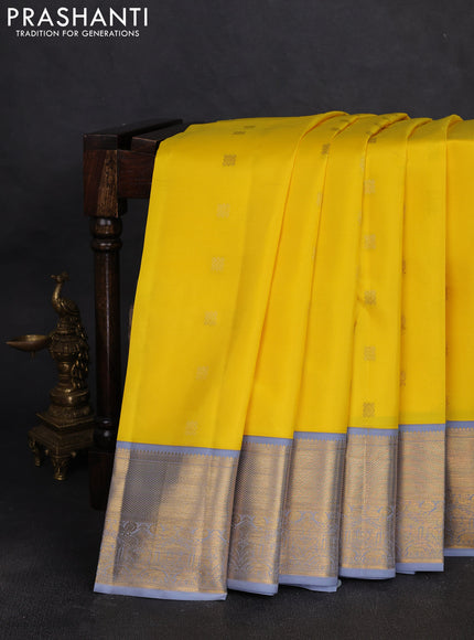 Pure kanchipuram silk saree yellow and grey with allover zari woven buttas and zaari woven korvai border