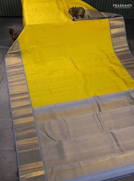 Pure kanchipuram silk saree yellow and grey with allover zari woven buttas and zaari woven korvai border