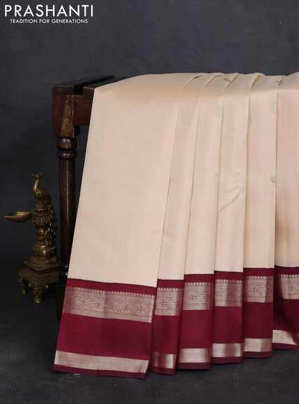Pure kanchipuram silk saree off white and deep maroon with zari woven buttas and rettapet zari woven border