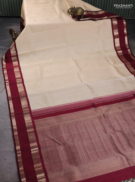 Pure kanchipuram silk saree off white and deep maroon with zari woven buttas and rettapet zari woven border