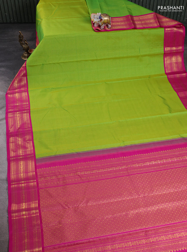 Pure kanchipuram silk saree fluorescent green and pink wwith allover zari small checked pattern and zazri woven border