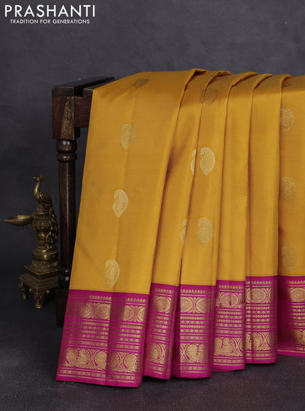 Pure kanchipuram silk saree mango yellow and pink with paisley zari woven buttas and zari woven korvai border
