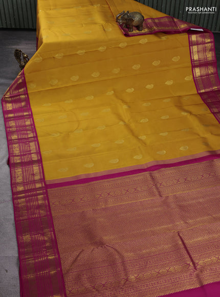 Pure kanchipuram silk saree mango yellow and pink with paisley zari woven buttas and zari woven korvai border