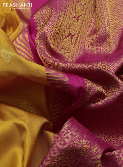 Pure kanchipuram silk saree mango yellow and pink with paisley zari woven buttas and zari woven korvai border