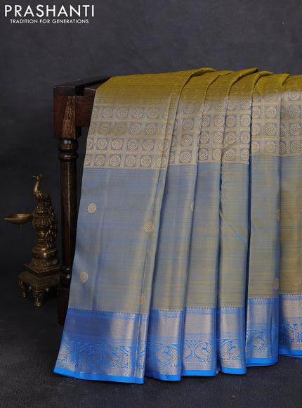 Pure kanchipuram silk saree dual shade of bluish yellow and cs blue with allover zari brocade weaves and long zari woven butta border