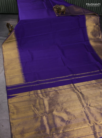 Pure kanchipuram silk saree blue and gold with plain body and temple rich zari woven border