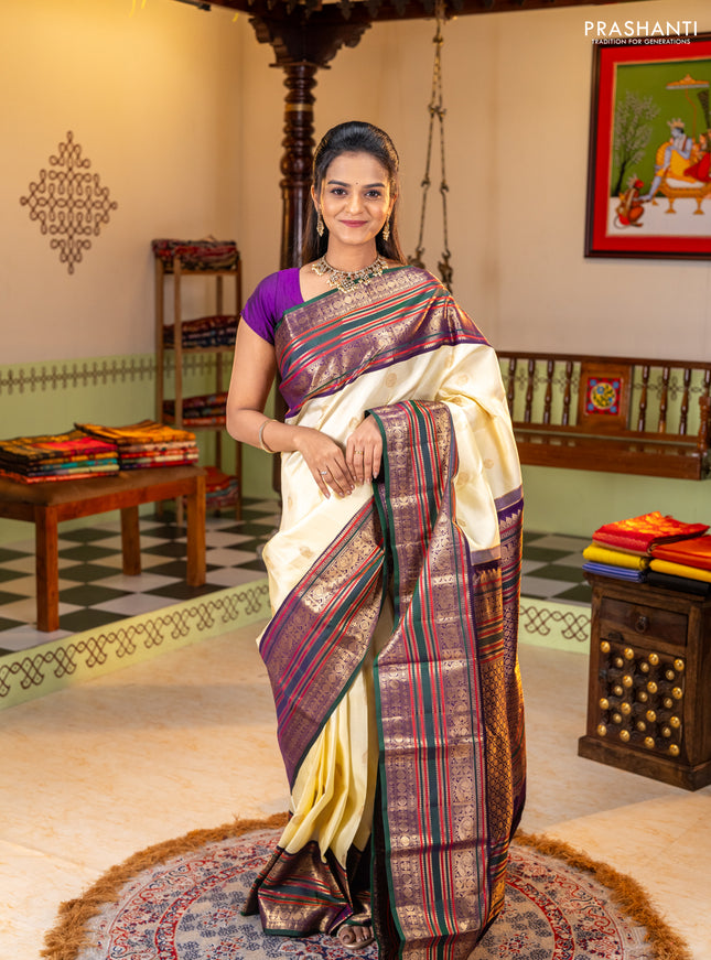 Pure kanchipuram silk saree cream and bottle green with zari woven buttas and long zari woven korvai border