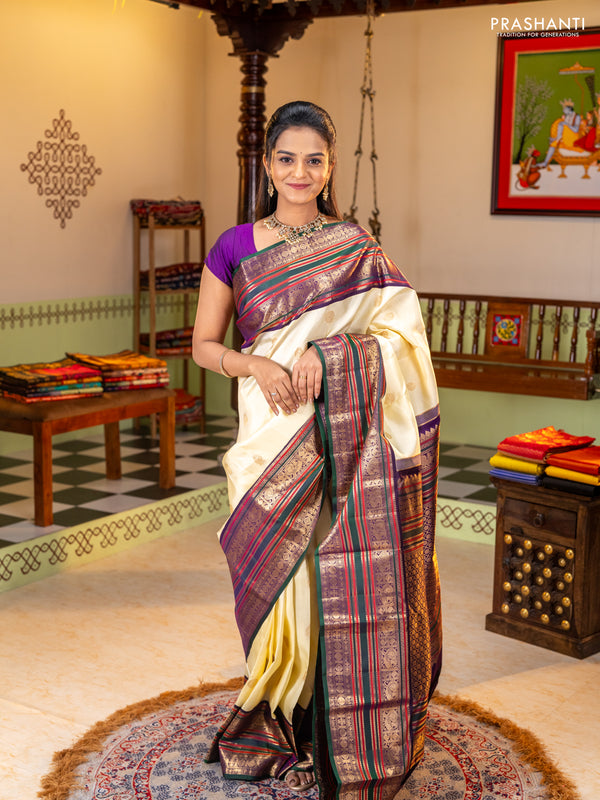 Pure kanchipuram silk saree cream and bottle green with zari woven buttas and long zari woven korvai border