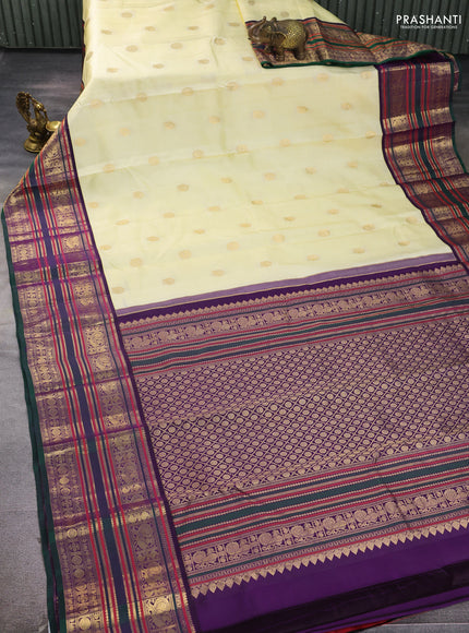Pure kanchipuram silk saree cream and bottle green with zari woven buttas and long zari woven korvai border