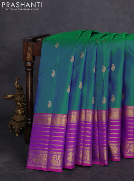 Pure kanchipuram silk saree dual shade of bluish green and pink with paisley zari woven buttas and long zari woven korvai border