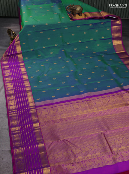 Pure kanchipuram silk saree dual shade of bluish green and pink with paisley zari woven buttas and long zari woven korvai border