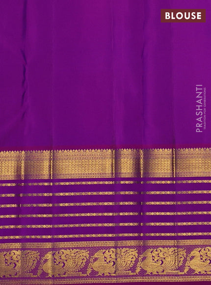 Pure kanchipuram silk saree dual shade of bluish green and pink with paisley zari woven buttas and long zari woven korvai border