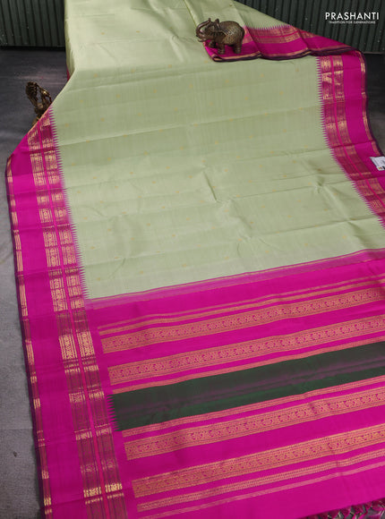 Pure kanchipuram silk saree pista green and pink with zari woven buttas and temple design rettapet zari woven border