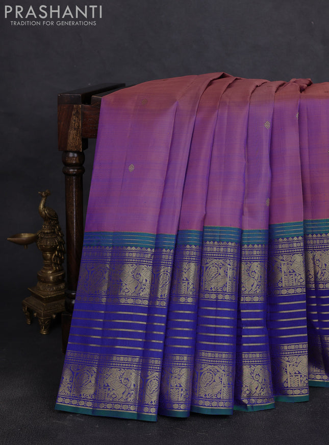 Pure kanchipuram silk saree dual shade of purple and peacock blue with allover zari woven buttas and long zari woven border