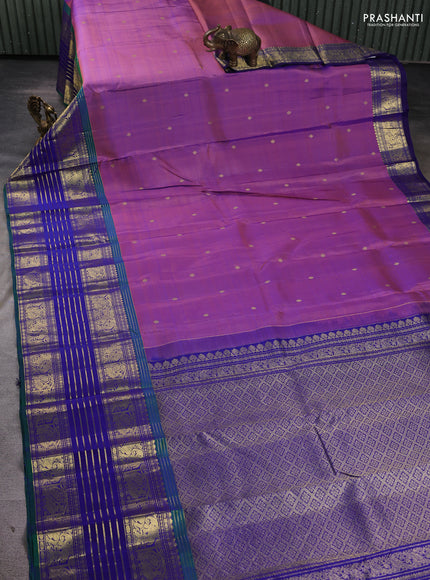 Pure kanchipuram silk saree dual shade of purple and peacock blue with allover zari woven buttas and long zari woven border
