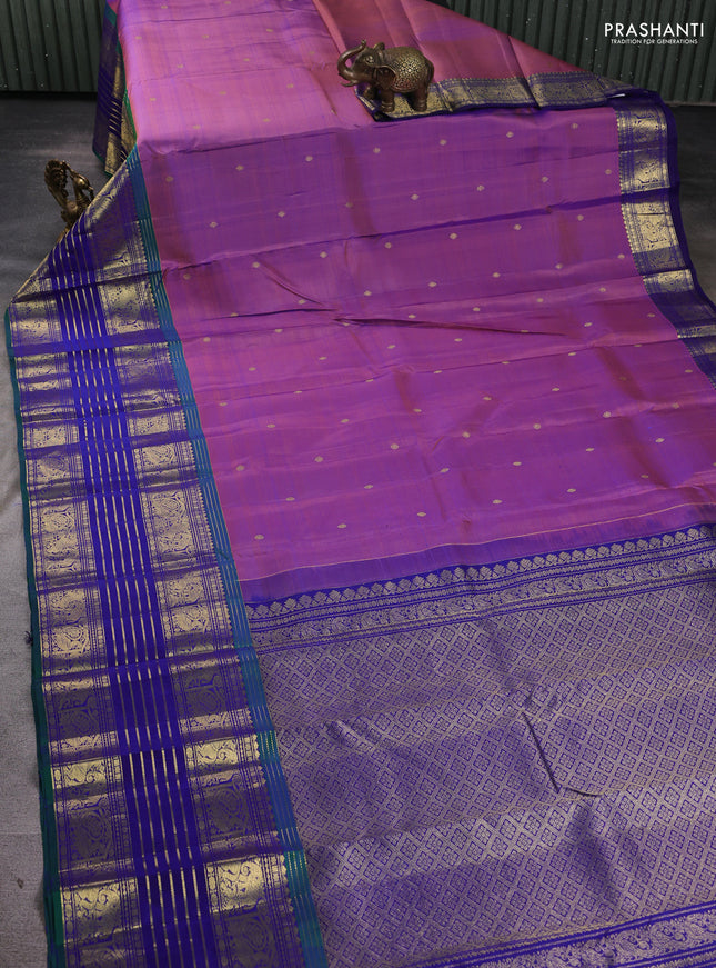 Pure kanchipuram silk saree dual shade of purple and peacock blue with allover zari woven buttas and long zari woven border