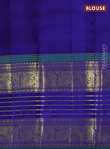 Pure kanchipuram silk saree dual shade of purple and peacock blue with allover zari woven buttas and long zari woven border