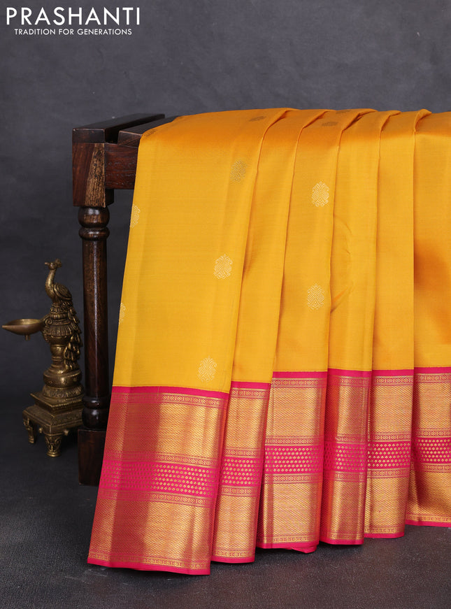 Pure kanchipuram silk saree yellow and dark pink with allover zari woven buttas and long rich zari woven border