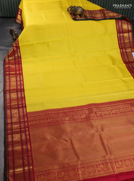 Pure kanchipuram silk saree yellow and maroon with allover zari weaves and zari woven border