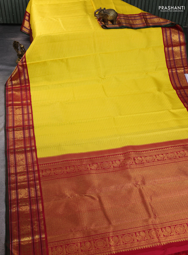 Pure kanchipuram silk saree yellow and maroon with allover zari weaves and zari woven border