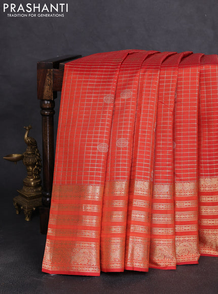 Pure kanchipuram silk saree orange with allover zari checks & buttas and long zari woven border