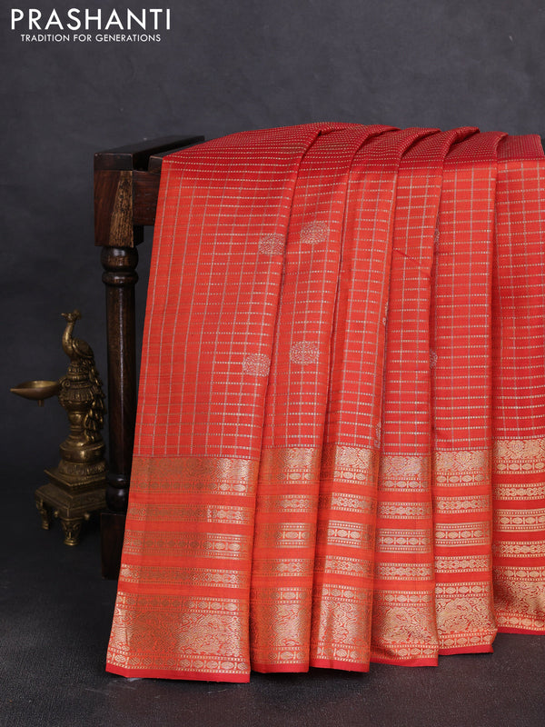 Pure kanchipuram silk saree orange with allover zari checks & buttas and long zari woven border
