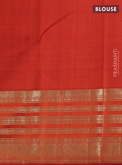Pure kanchipuram silk saree orange with allover zari checks & buttas and long zari woven border