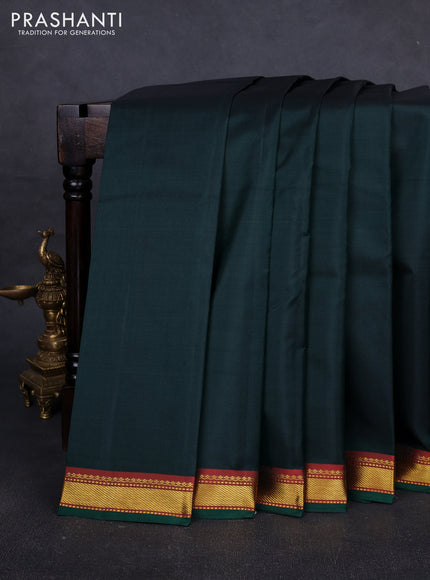 Pure kanchipuram silk saree bottle green and orange with plain body and zari woven border