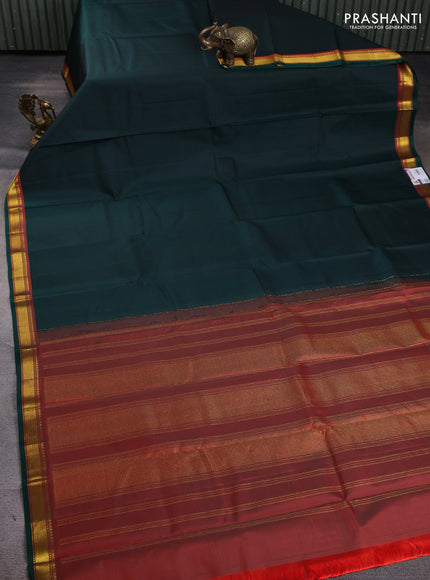 Pure kanchipuram silk saree bottle green and orange with plain body and zari woven border